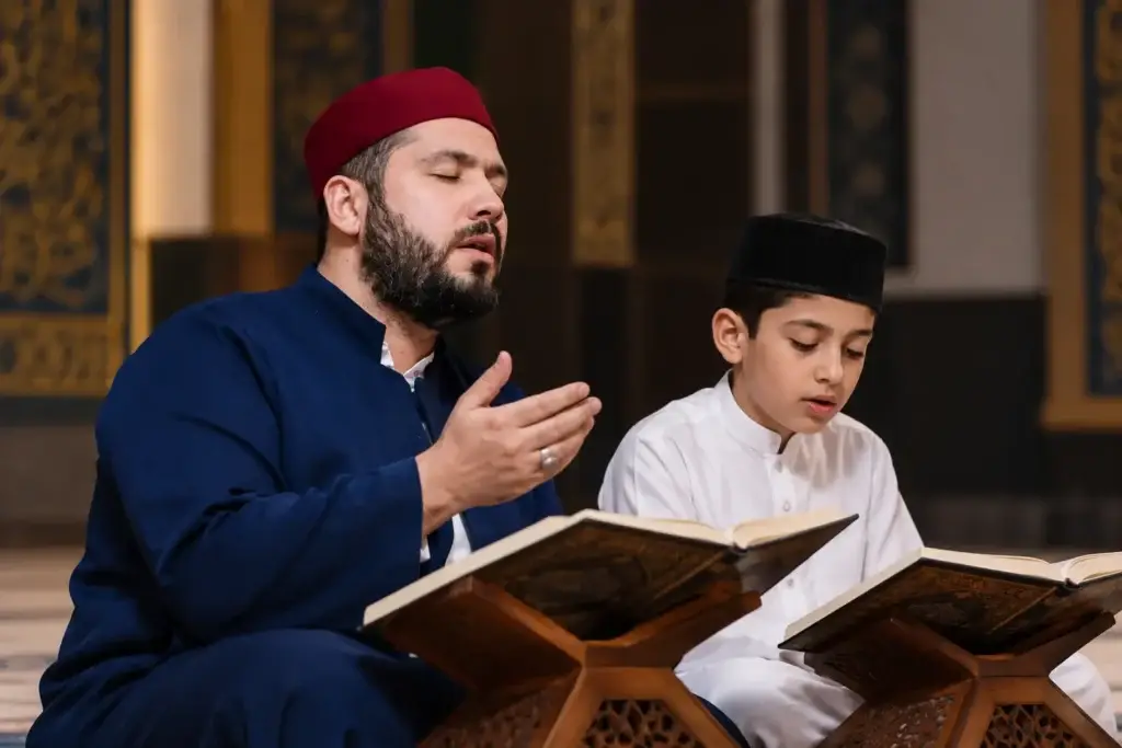 a photo of a teacher and student reciting, or of Shaykh Hassan Ali Kasi reciting